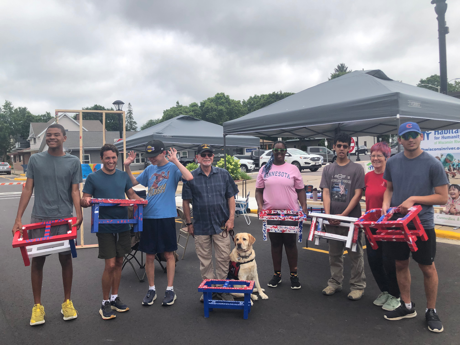 Volunteers and a service dog at a community build event