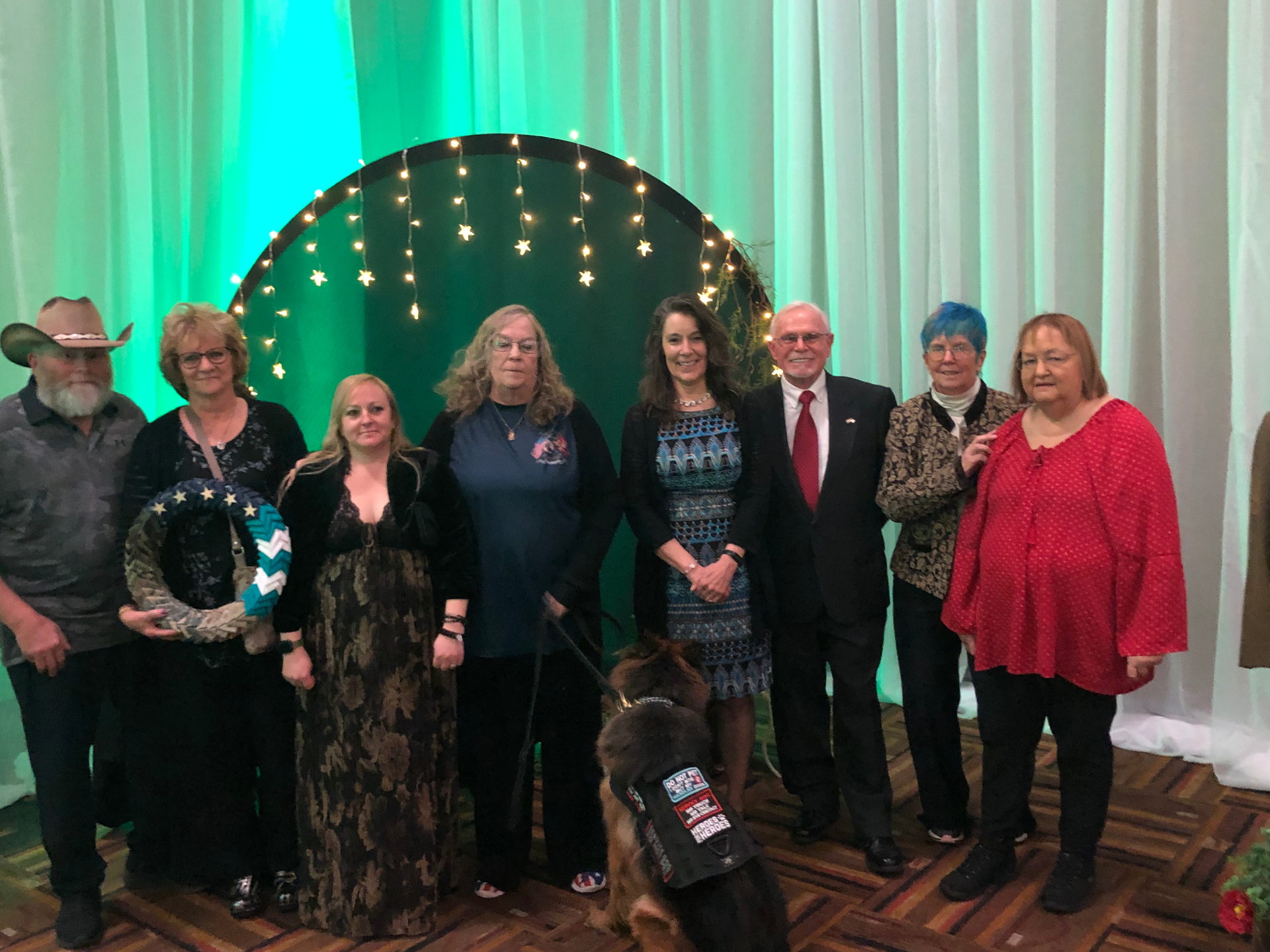 Board members, supporters, and a service dog at the annual gala